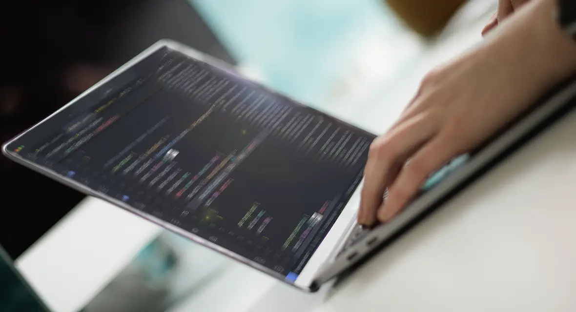 Zoomed in images of hands typing on a laptop keyboard
