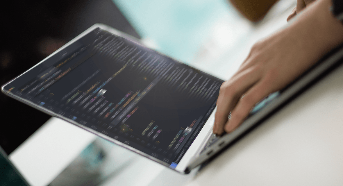 Zoomed in images of hands typing on a laptop keyboard